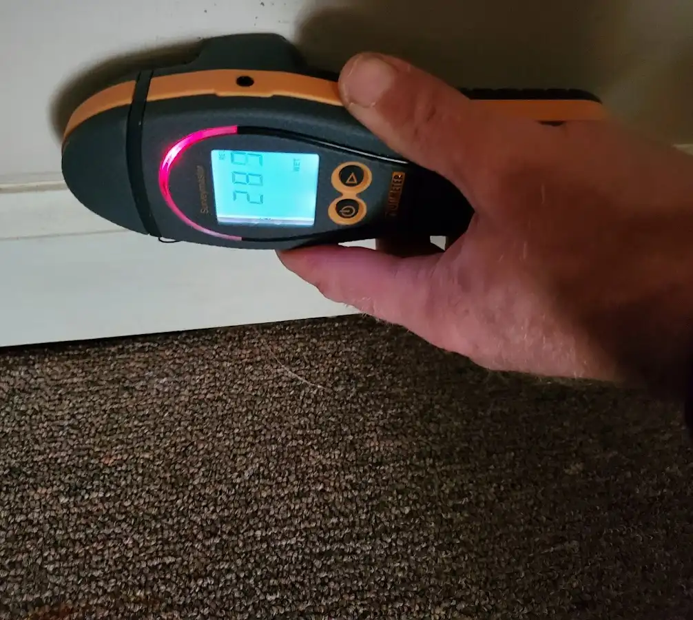 Moisture detection at baseboard during Storm Damage Restoration in Mission